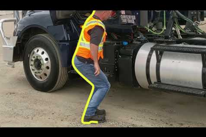 truck driver demonstrating how to enter a semi truck properly