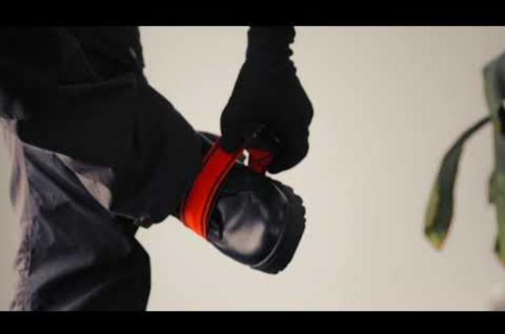 Truck driver putting on safety uniform