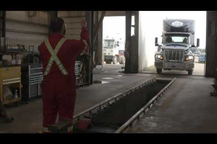 truck is entering a garage