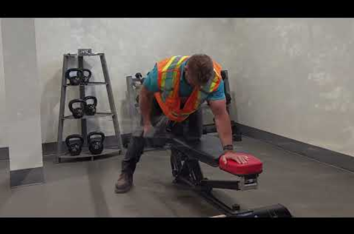 Truck driver working out in the gym